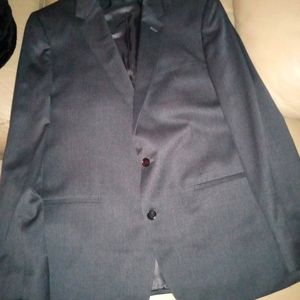 A suit from The BLK Tux company